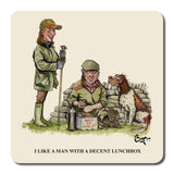 A woman in outdoor gear smiles with a sandwich while a man eats beside his dog, echoing the charm of CountrysideGreetings Set of Six Bryn Parry Shooting Cartoons Coasters from the iconic Sex in the Country series.