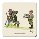 Two women sit on a bench, one holding a fork, as a uniformed man stands nearby with champagne and CountrysideGreetings Set of Six Bryn Parry Shooting Cartoons Coasters – Sex in the Country Series. Caption: FEEDING THE BIRDS.