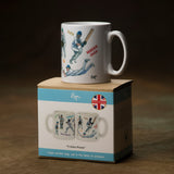 The Cricket Mug: Cricketing Terms by Bryn Parry from CountrysideGreetings features fun cricket-themed illustrations and phrases like Duck and Maiden Over, and comes in a box displaying its design—a perfect gift for cricket fans.