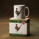 The Pheasant Shooting Mug – The Veteran by Bryn Parry, from CountrysideGreetings, is a white ceramic mug for shooting enthusiasts. It comes in a matching box with the same illustration, British flag, and British origin text.