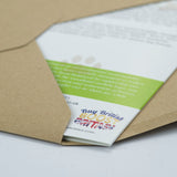 A Countryside Greetings envelope is partially open, revealing Dick Twinneys Know Your Dog Springer Spaniel Greeting Card—a charming tribute to the beloved breed. The leaflet displays colorful text: Buy British BOOST BRITAIN.
