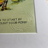 Close-up of the lower right corner of CountrysideGreetings Cartoon pony print. It is a good idea to start by learning how to mount your pony by Norman Thelwell shows an embossed stamp and partial title text—classic British countryside art.