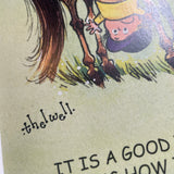 CountrysideGreetings’ Cartoon pony print, “It is a good idea to start by learning how to mount your pony” by Norman Thelwell, features a classic illustration of a child hanging upside down over a horse in Thelwell’s charming British countryside style.