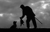 Countryside Greetings presents 10 Shooting notecards with envelopes by Charles Sainsbury-Plaice—featuring a silhouette of a person, bird, and dog against a cloudy sky—ideal for country sports enthusiasts.