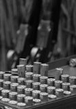 This set of 10 Shooting notecards with envelopes by Charles Sainsbury-Plaice from Countryside Greetings features a black and white photo of neatly arranged shotgun shells with blurred firearms in the background, capturing classic country sports.