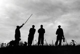 Countryside Greetings 10 Shooting notecards with envelopes by Charles Sainsbury-Plaice depict four silhouetted figures on a hill under clouds, one pointing with a stick, with two dogs nearby among grass and plants.