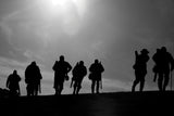 Ten shooters silhouetted on a grassy hill beneath a bright sky feature on Countryside Greetings’ “10 Shooting notecards with envelopes by Charles Sainsbury-Plaice,” capturing the essence of country sports.