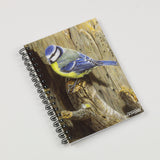 The Bird themed A6 lined notebook, Blue Tit by Dick Twinney from Countryside Greetings, features a blue tit on a rustic wood cover—an ideal spiral-bound addition to any nature-themed notebook collection.