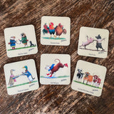Six Farm Animal Drinks Coasters by Alex Underdown from CountrysideGreetings rest on a wooden table, each showing quirky cartoon animals and crafted from sustainable cork for eco-friendly appeal.