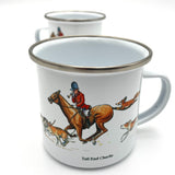 The Enamel Fox Hunting Mug by Bryn Parry from CountrysideGreetings features a horse rider in red, surrounded by foxes and Tail End Charlie text. With a silver rim and white background, it’s perfect for camping or outdoor adventures.