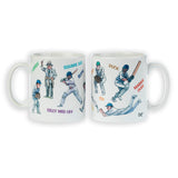 CountrysideGreetings’ Cricket Mug: Cricketing Terms by Bryn Parry features two white ceramic mugs with colorful cartoons of cricket players and terms like Silly Mid Off—a fun, quirky gift for cricket fans.