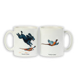The Cocker Spaniel Mug, Wocker Cocker by Bryn Parry from CountrysideGreetings, is a white ceramic mug featuring a black dog chasing a pheasant and Wocker Cocker printed below. Its dishwasher safe.