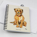 The Cartoon dog themed A6 lined notebook, Innocent by Bryn Parry from Countryside Greetings, features a charming Border Terrier cartoon with a scruffy tan-and-white coat and red collar.