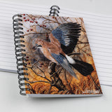 The Bird themed A6 lined notebook, Autumn Jay by Dick Twinney from Countryside Greetings, features a spiral binding and a cover with a jay on a branch among autumn leaves and red berries.