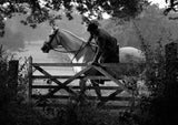 The Horse & Pony Notecards Multipack by Charles Sainsbury-Plaice from Countryside Greetings features a black and white photo of a rider opening a wooden gate in the rural countryside, evoking timeless charm.