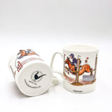 Two Clearing the Pole Bone China Horse Riding Mugs by CountrysideGreetings, featuring Bryn Parrys vibrant show jumping design—one shown upright, the other on its side displaying the base. Made in the UK; dishwasher safe. Perfect gift for tea lovers and show jumpers.