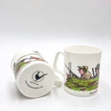 A CountrysideGreetings The Glorious Twelfth bone china shooting mug features Bryn Parrys cartoon hunting scene and a black pipe logo with website on the base.