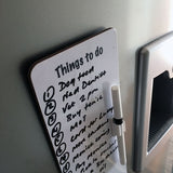 The Slim magnetic memo dry wipe things to do board by CountrysideGreetings features tasks like Dog food and Vet 2pm, comes with an attached marker, and fits by the fridge—ideal for staying organised with style. Artwork: Teamwork by Bryn Parry.