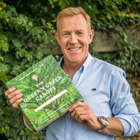 Adam Henson contributor to the Queens Green Canopy Book with his copy.