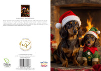 Two dachshunds wearing Christmas hats in front of a fireplace.
