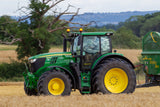 John Deere tractor in cereal field at harvest