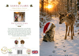Front and back cover of a Christmas Card titled 'Santa Claws Christmas Tales: The Curious Fawn' showing a snowy woodland scene with a deer wearing a Santa hat on the front and product details including author, publisher, and barcode on the back.