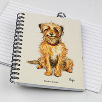 Cartoon dog themed A6 lined notebook. Innocent by Bryn Parry