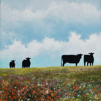 Black cattle and wildflowers